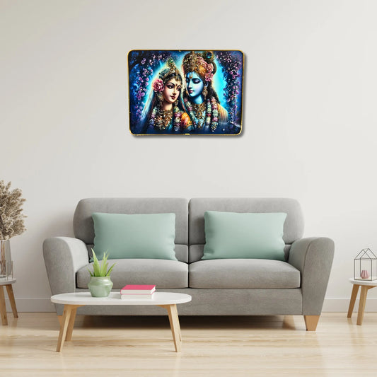 Framed artwork of two figures on a wall above a gray sofa with light green cushions.