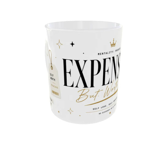 Front view of Expensive But Worth It ceramic mug with premium black and gold typography.