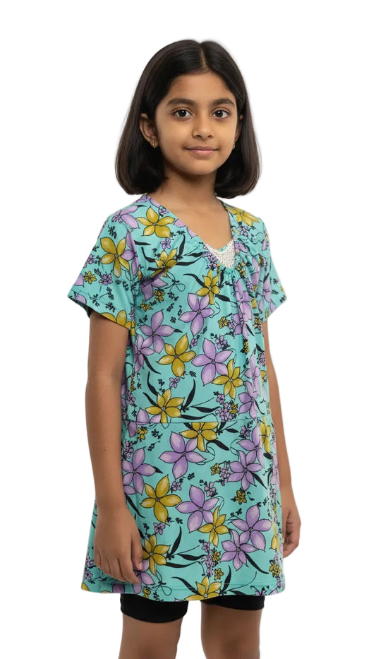 Young girl wearing a floral dress with a white background