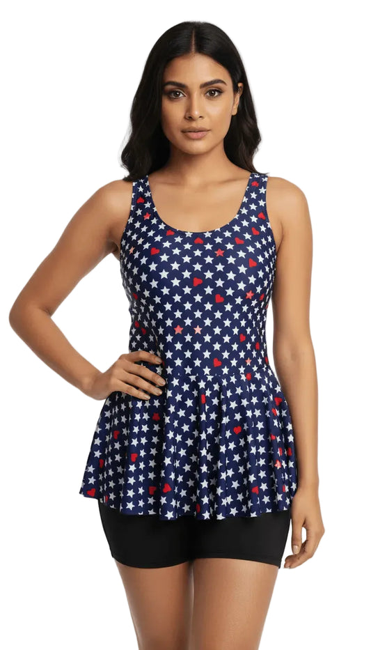 Woman wearing a navy blue tank top with red and white star pattern on a white background