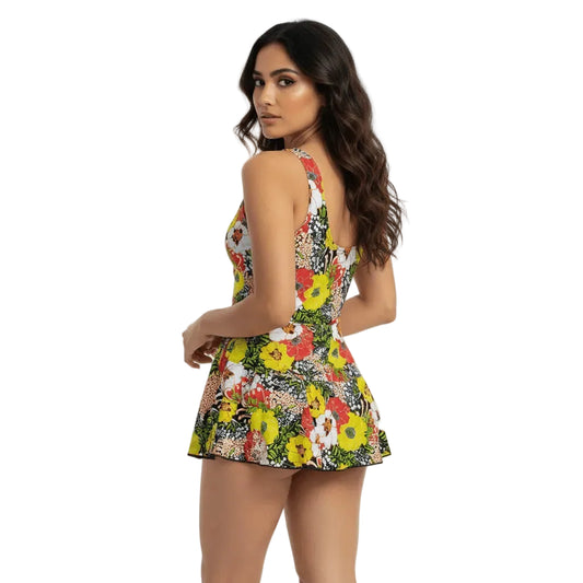 Woman wearing a colorful floral dress on a white background