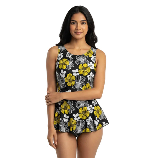 Woman wearing a floral dress with yellow and white flowers on a black background