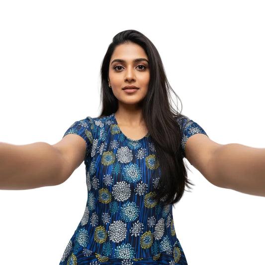 Woman wearing a blue floral dress against a white background