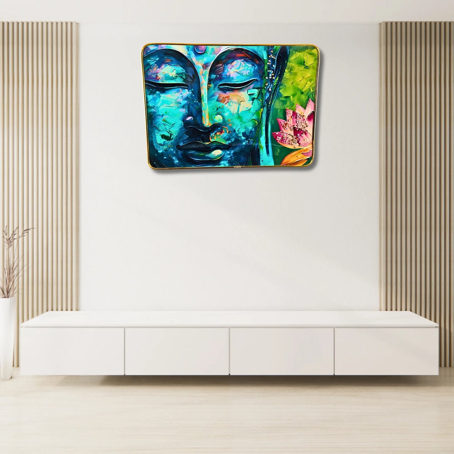 Colorful abstract painting of a Buddha face on a white wall above a white cabinet.