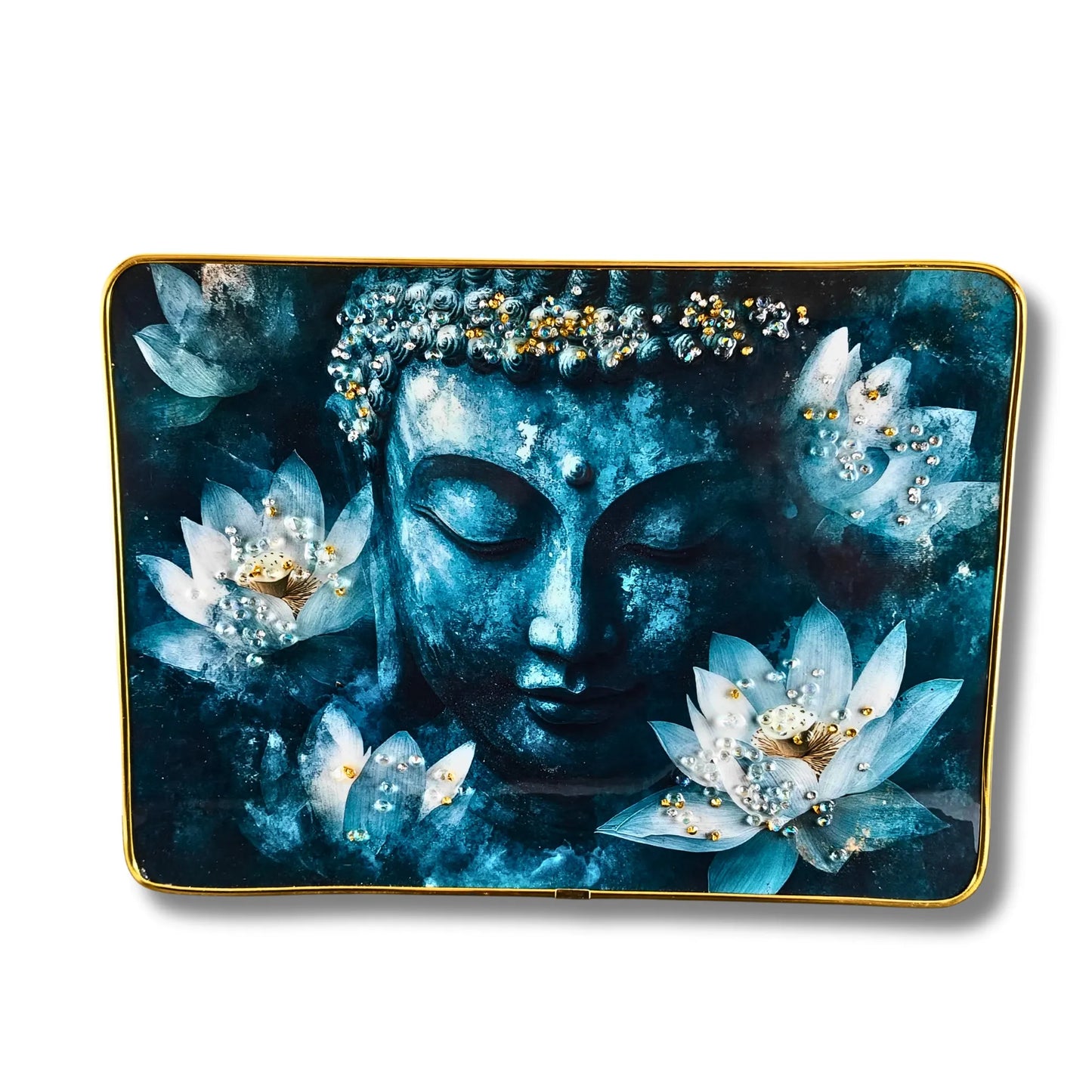 Decorative tray with a blue Buddha face and lotus flowers on a dark background