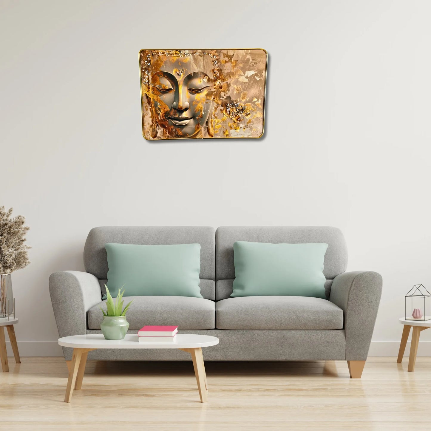 Living room with a gray sofa, coffee table, and wall art of a Buddha face.