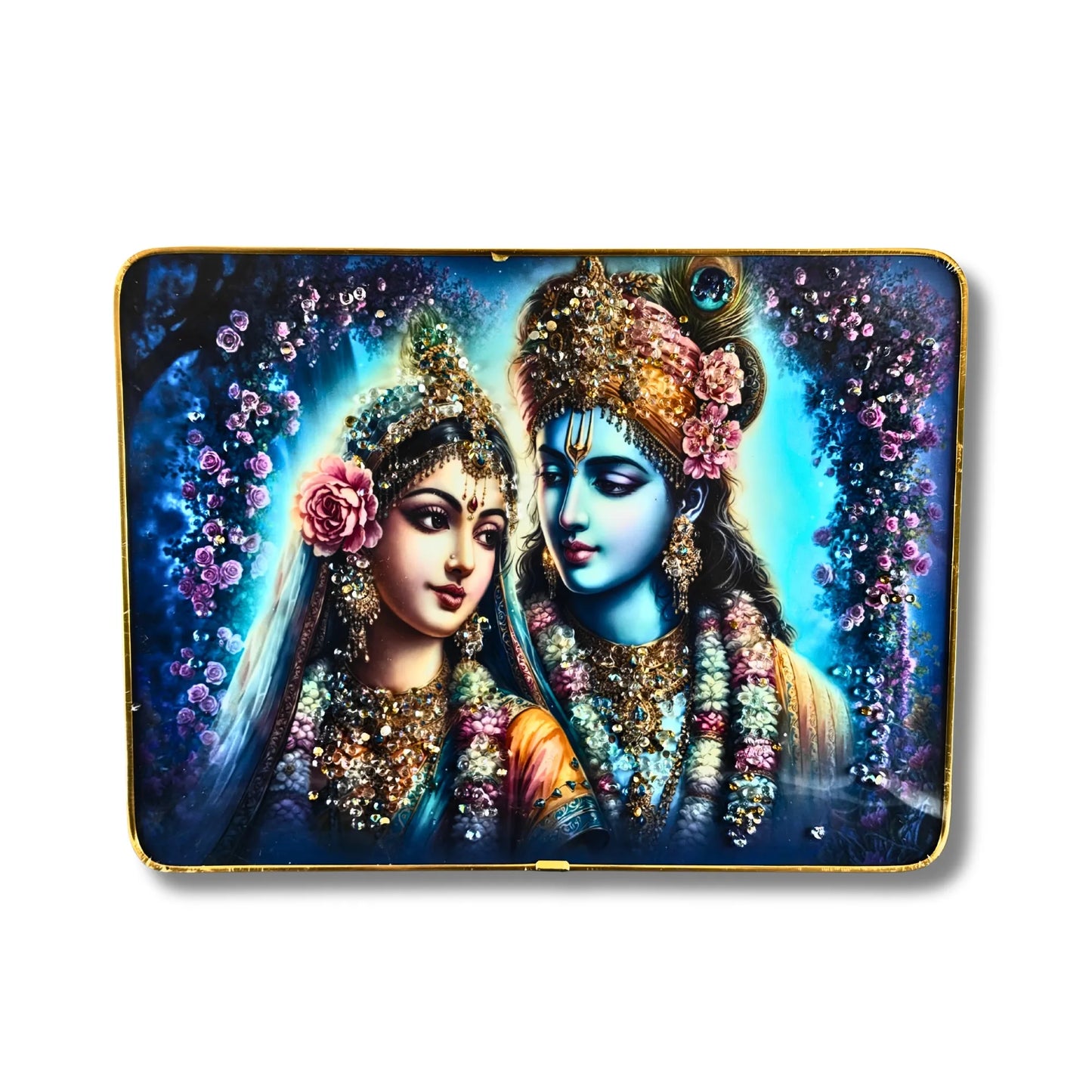 Decorative box with a colorful depiction of two figures adorned with flowers and jewelry on a blue background.