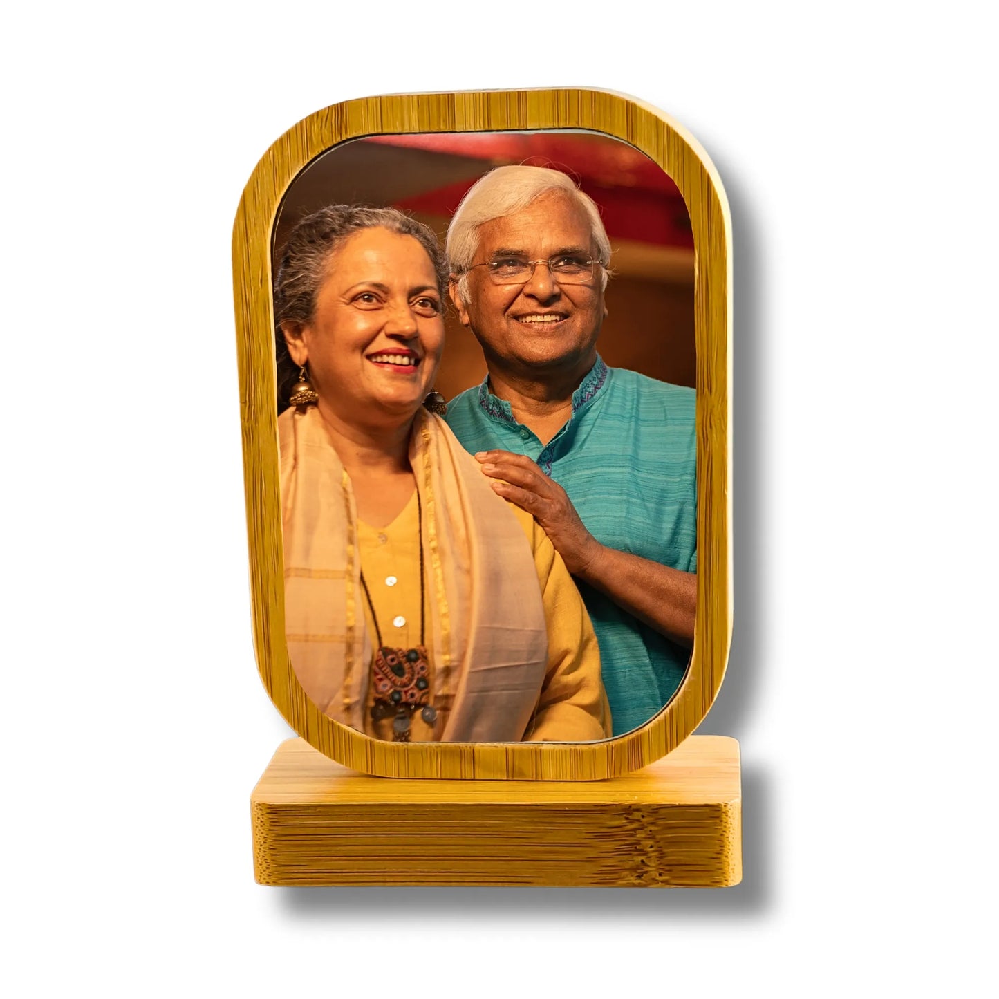Wooden photo frame with a mirror containing an image of two people.