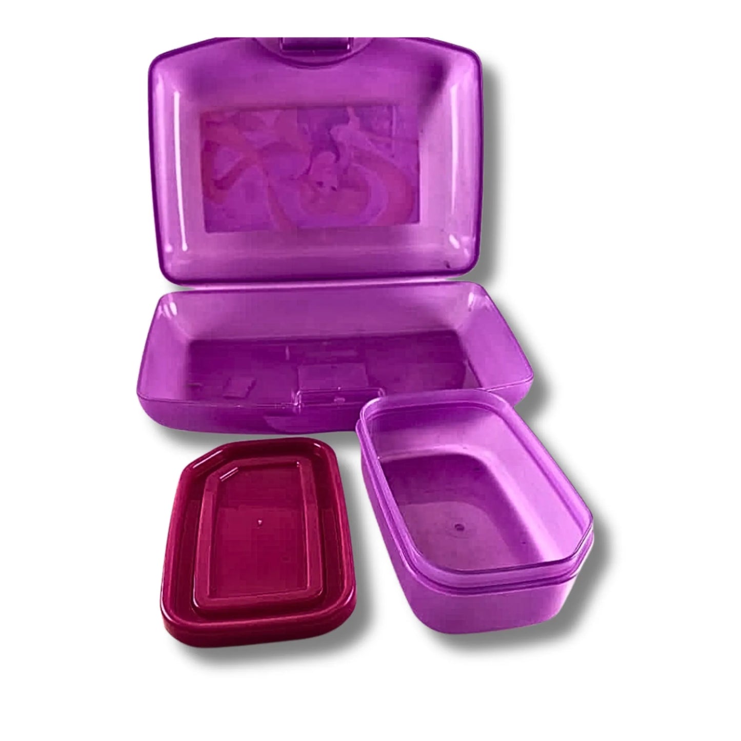 Purple plastic container set with various compartments on a white background