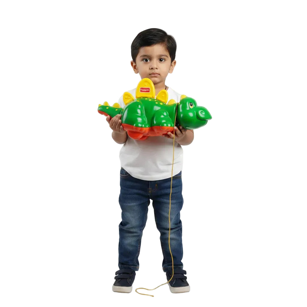 Child holding a green toy Crocodile on a white background