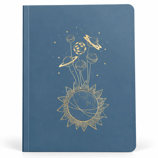 A blue hardcover notebook featuring a gold line-art illustration of a sun and planets on the front cover, shown against a plain white background.