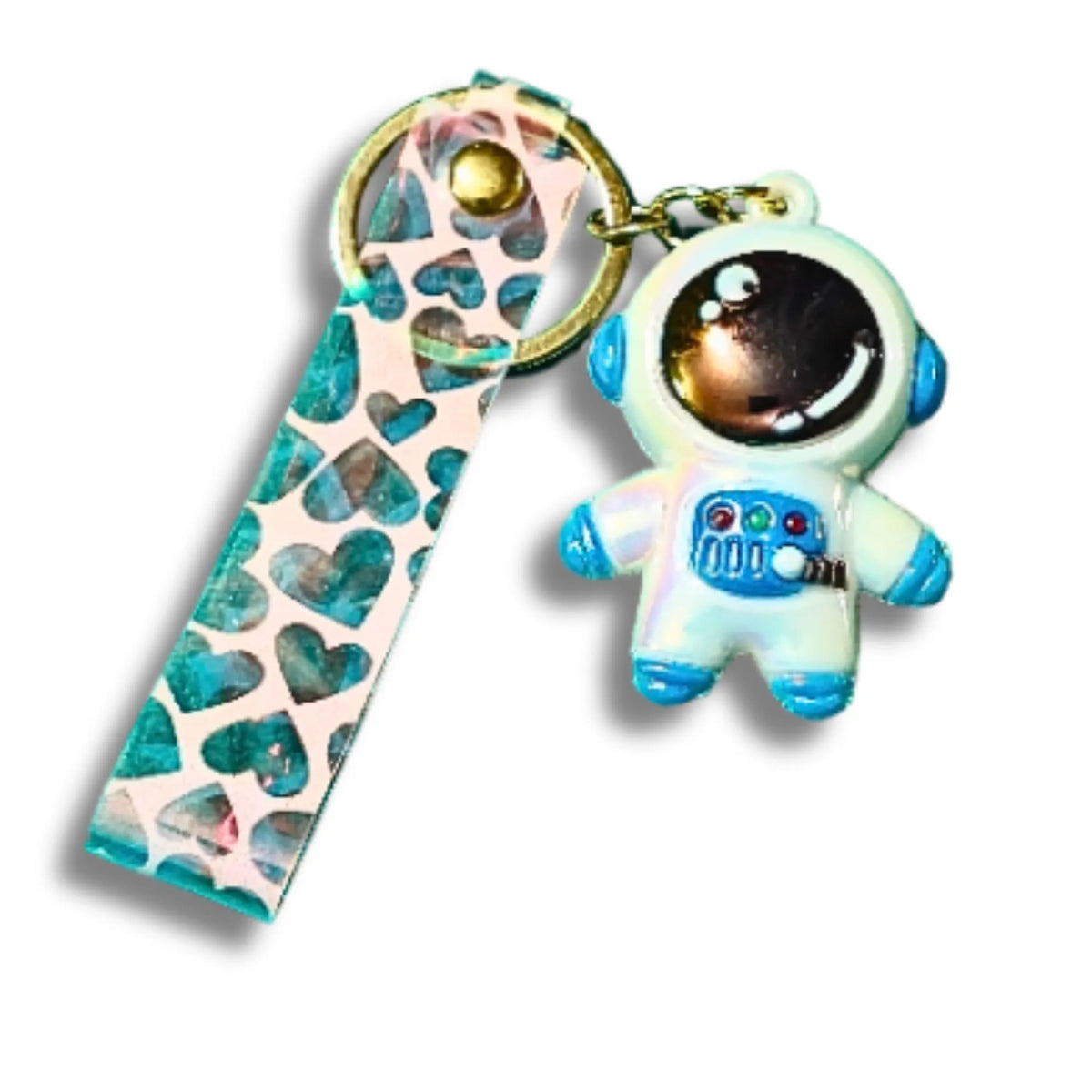 A keychain featuring a small astronaut charm in a white and blue space suit with a gold-tone ring, alongside a matching patterned leather strap with teal hearts on a white background.