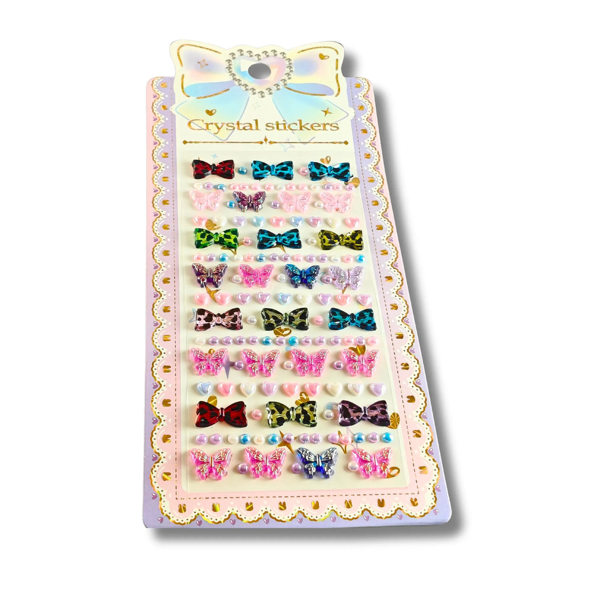 A package of decorative crystal stickers featuring bows, butterflies, pearls, and small rhinestones on a pastel card labeled 'Crystal stickers'.