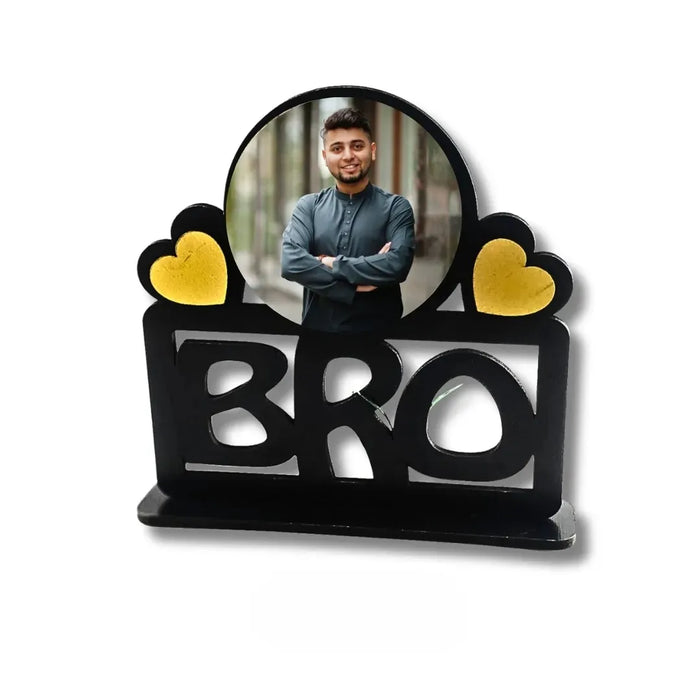Decorative item with 'BRO' and heart shapes, featuring a photo of a man.