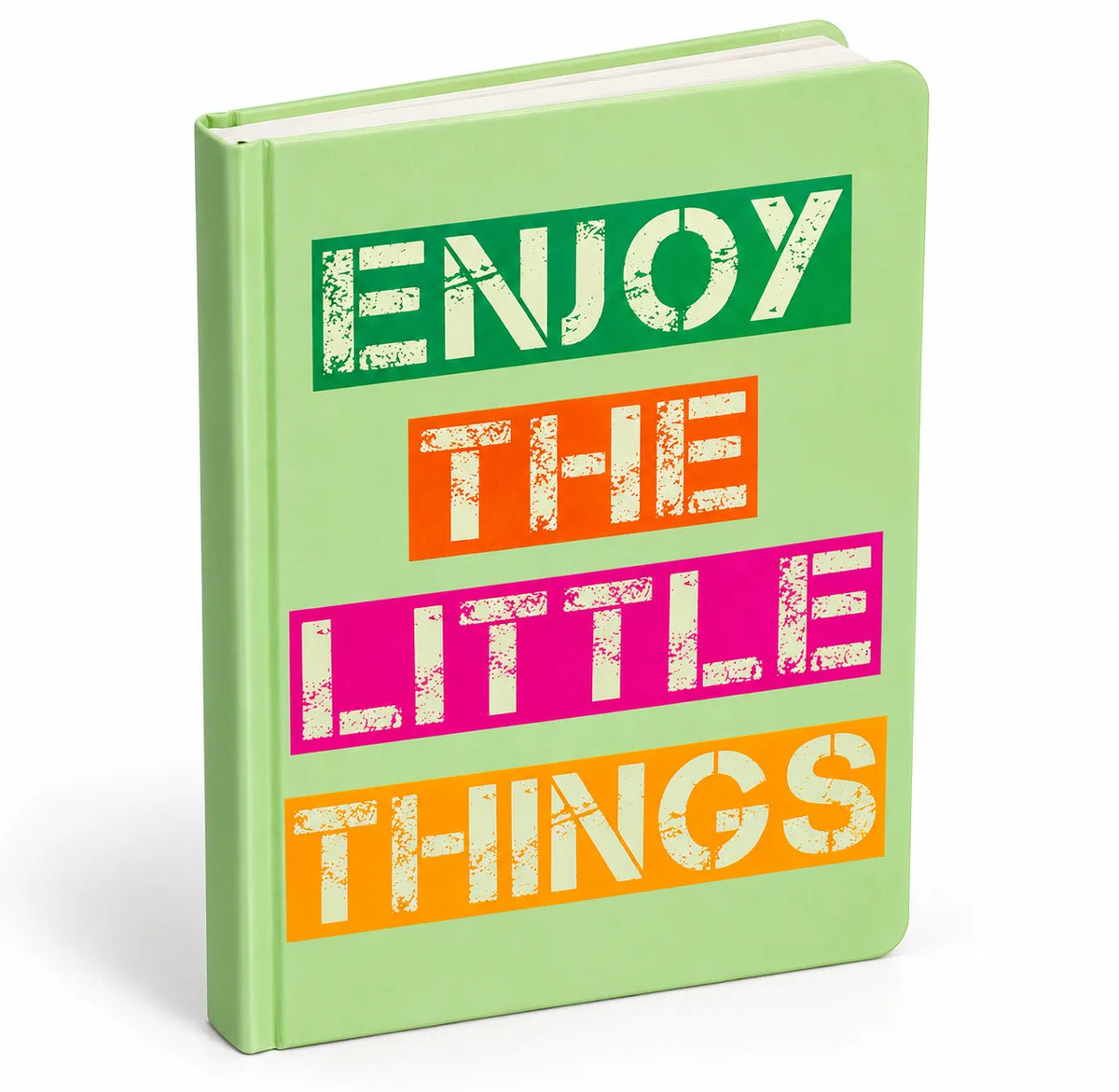 A hardcover notebook with a light green cover featuring the phrase 'ENJOY THE LITTLE THINGS' in bold, colorful rectangular blocks (green, orange, pink, orange) with distressed white lettering.