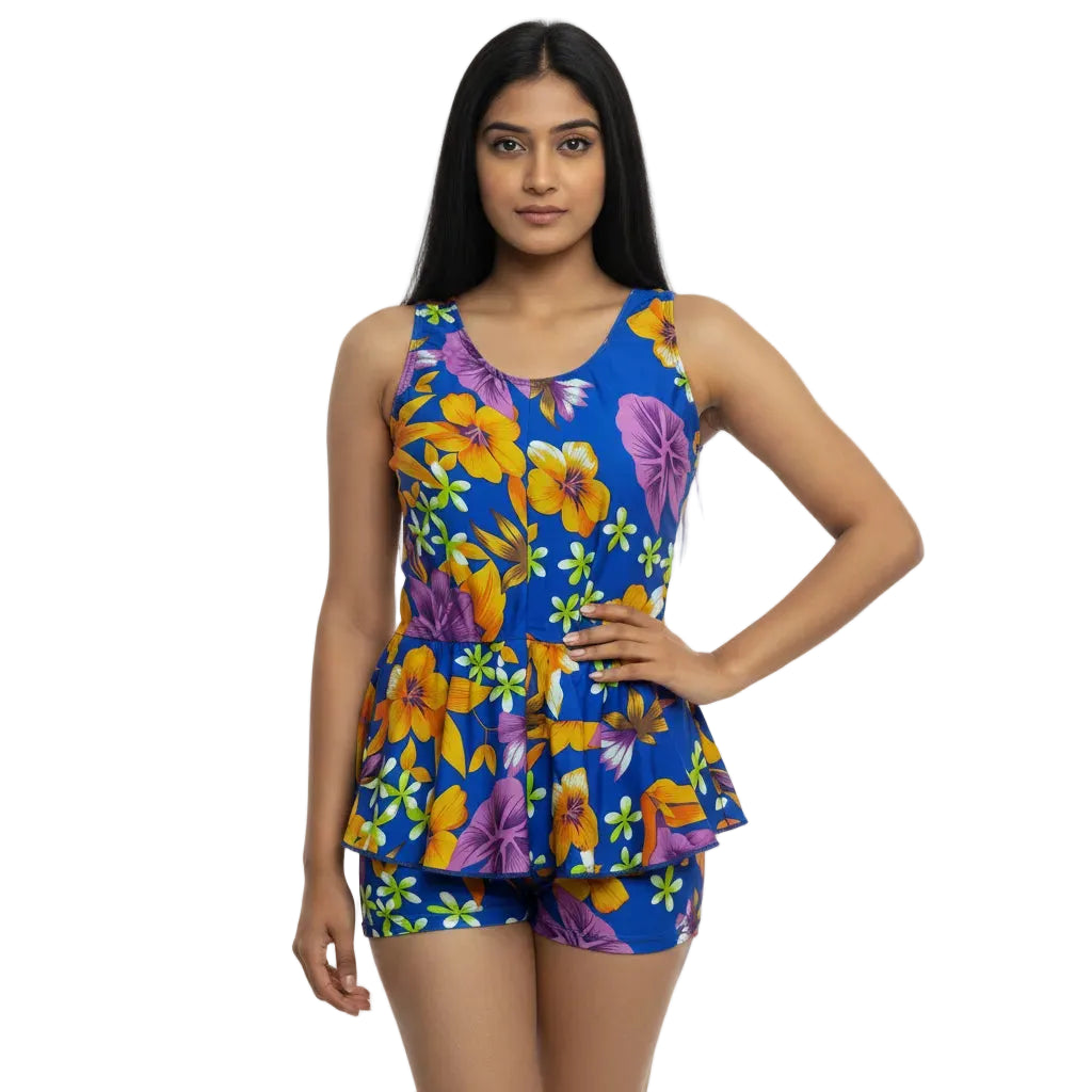 Woman wearing a colorful floral dress on a white background