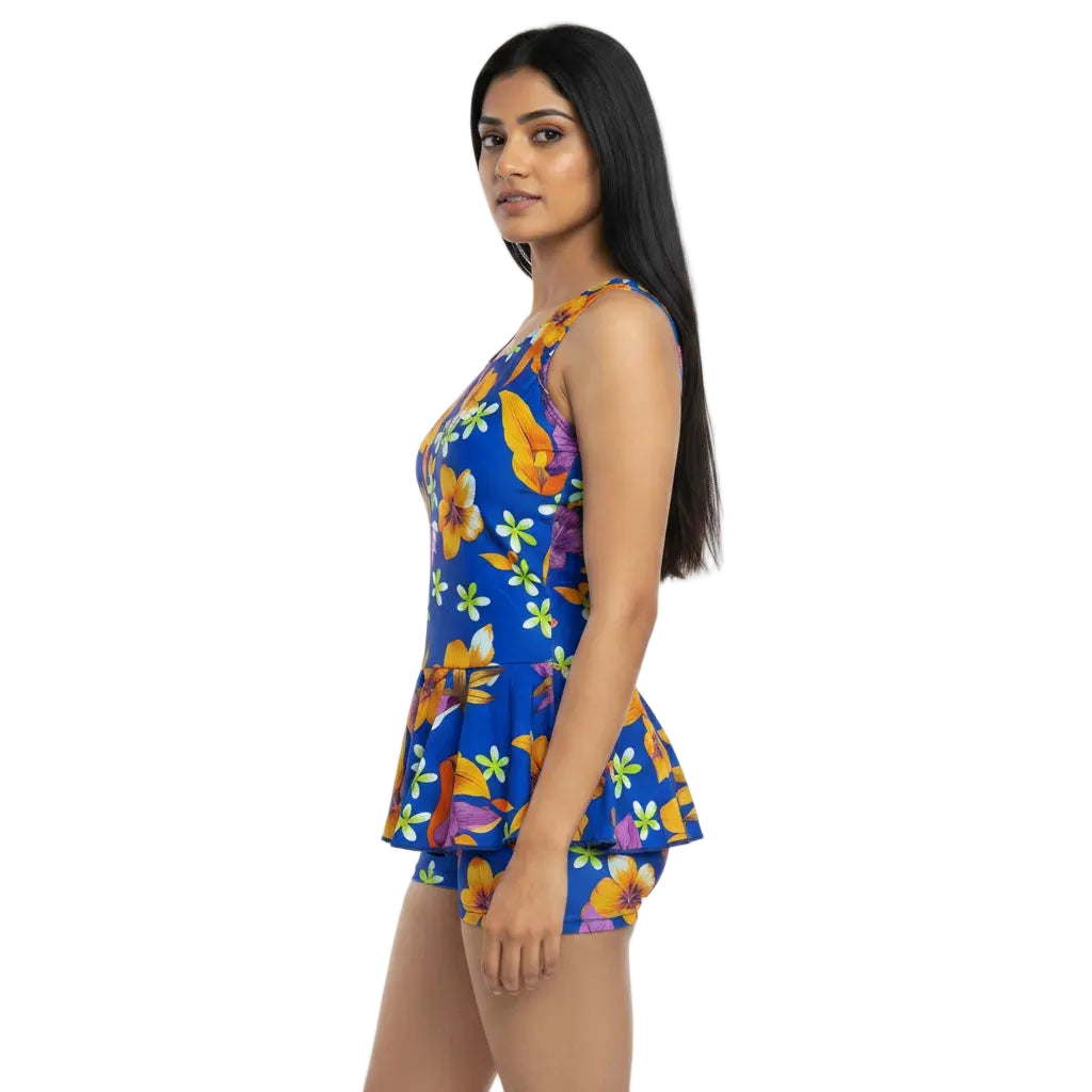 Woman wearing a colorful floral dress on a white background