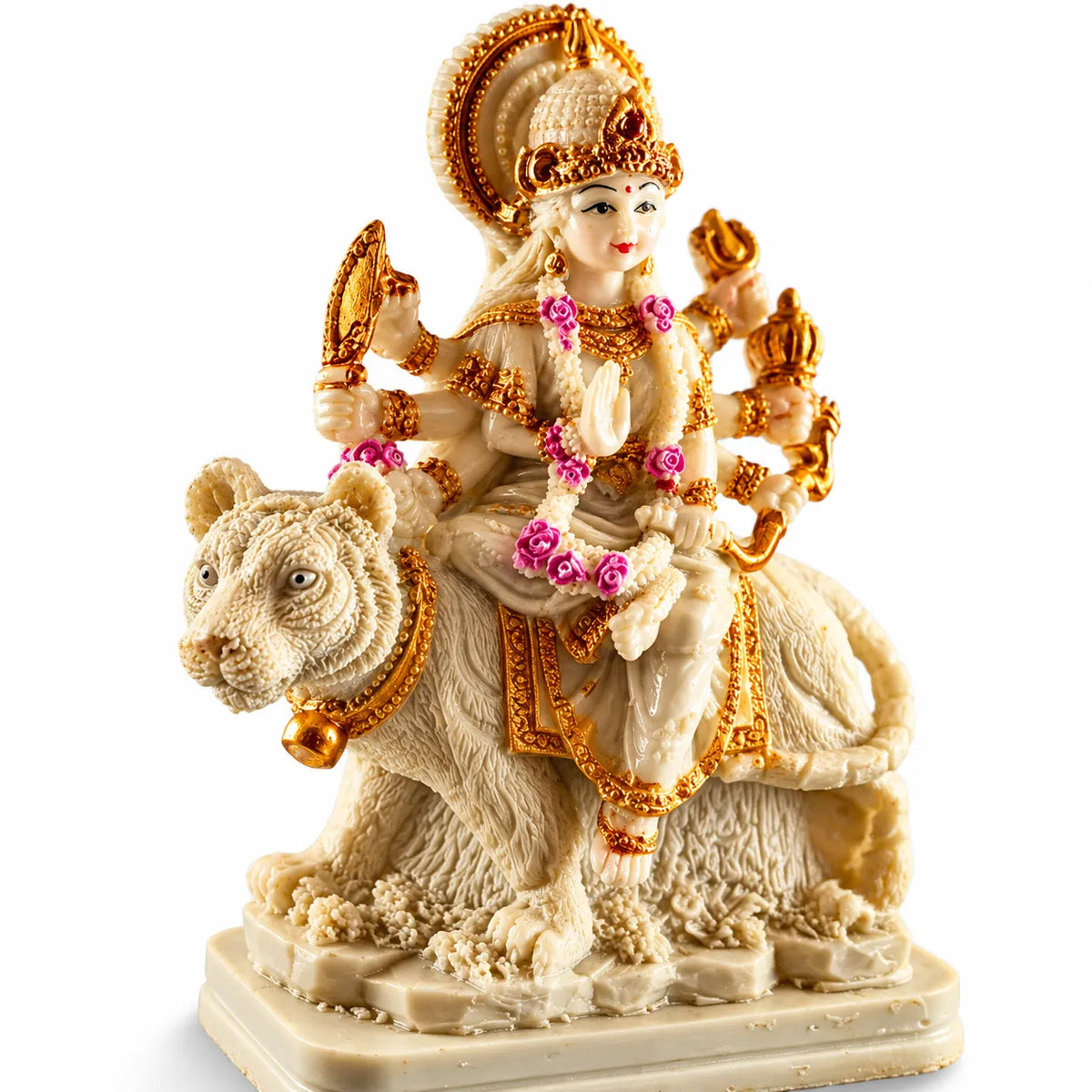 A detailed religious figurine of the Hindu goddess Lakshmi riding a white tiger, crafted in a cream-colored stone-like material with intricate gold-plated ornaments and pink floral accents, set against a plain white background.