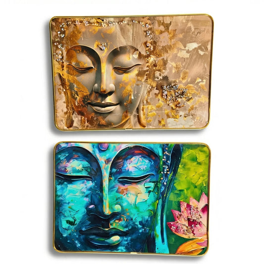 Two decorative trays with artistic depictions of Buddha faces on a white background