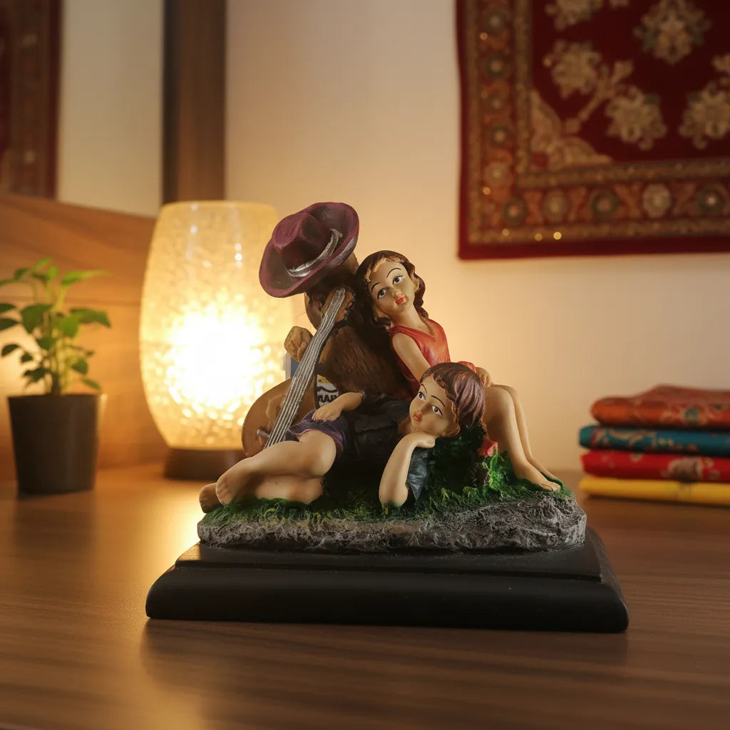 Decorative figurine of a couple with a guitar on a table with a warm light in the background.