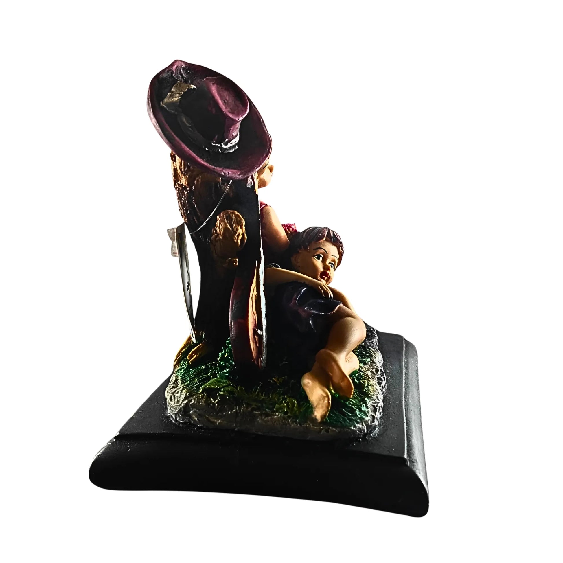 Decorative figurine with a person holding a hat on a white background