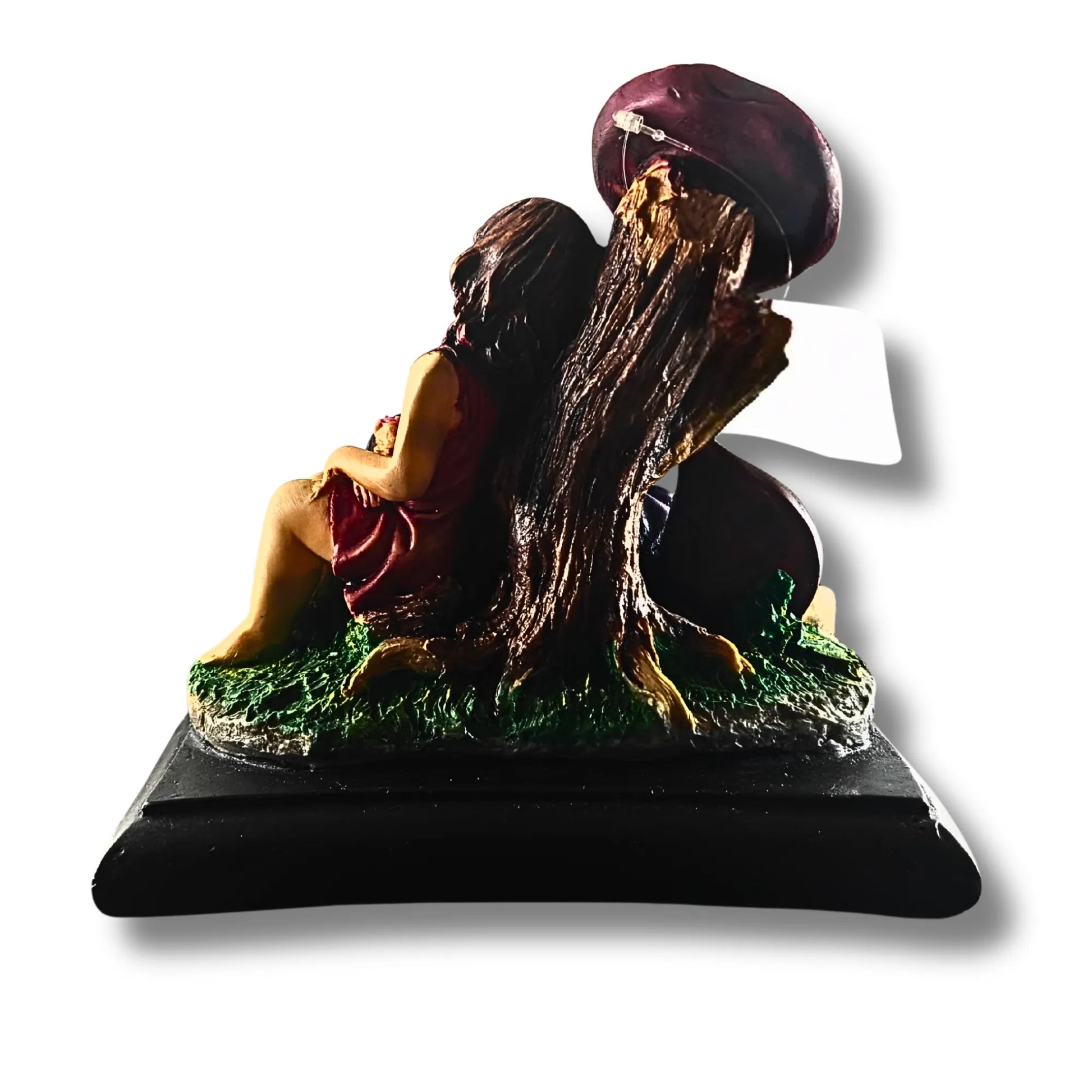 Statue of a woman sitting under a tree with a helmet on her head on a white background
