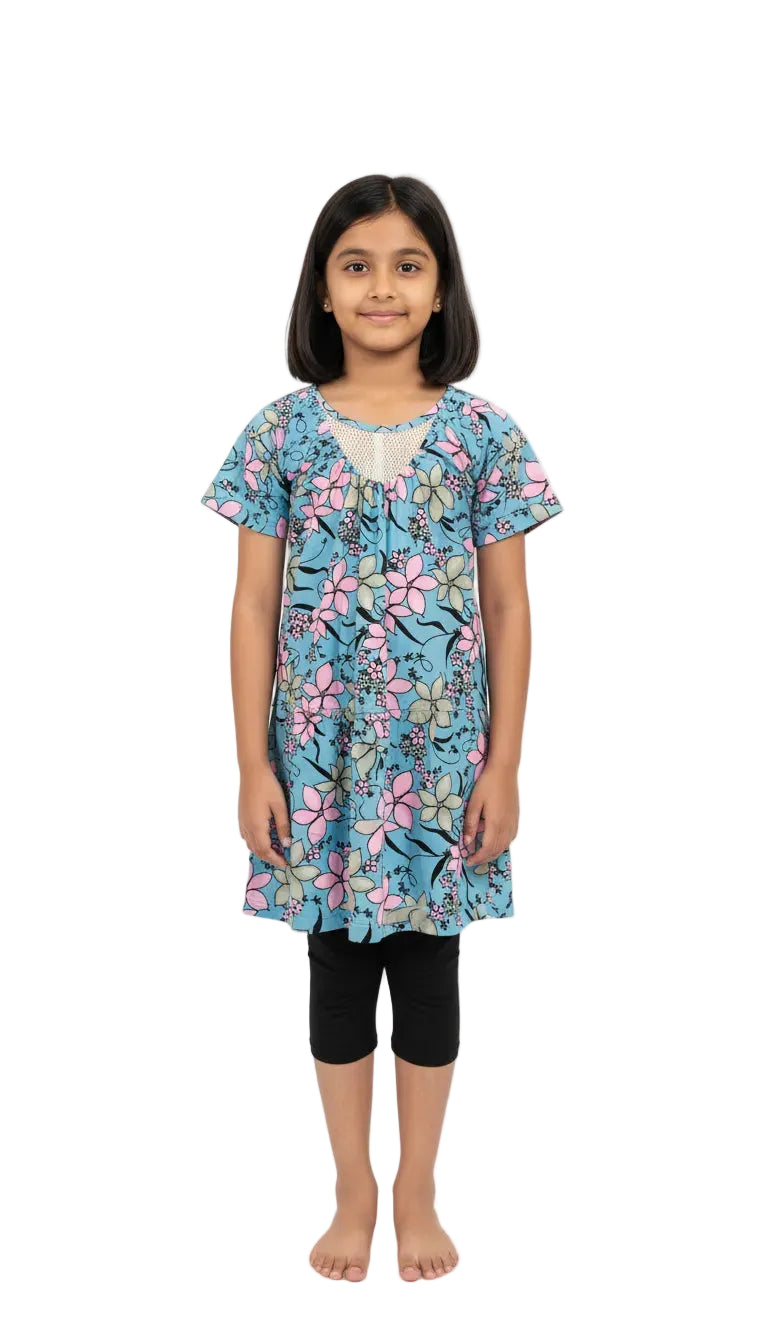 Young girl wearing a floral dress on a white background