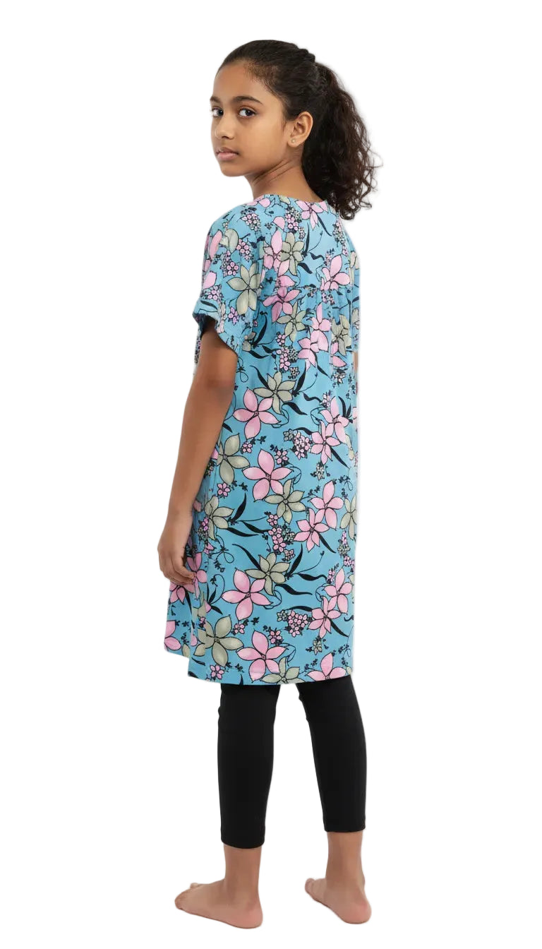 Girl wearing a floral dress with a blue background