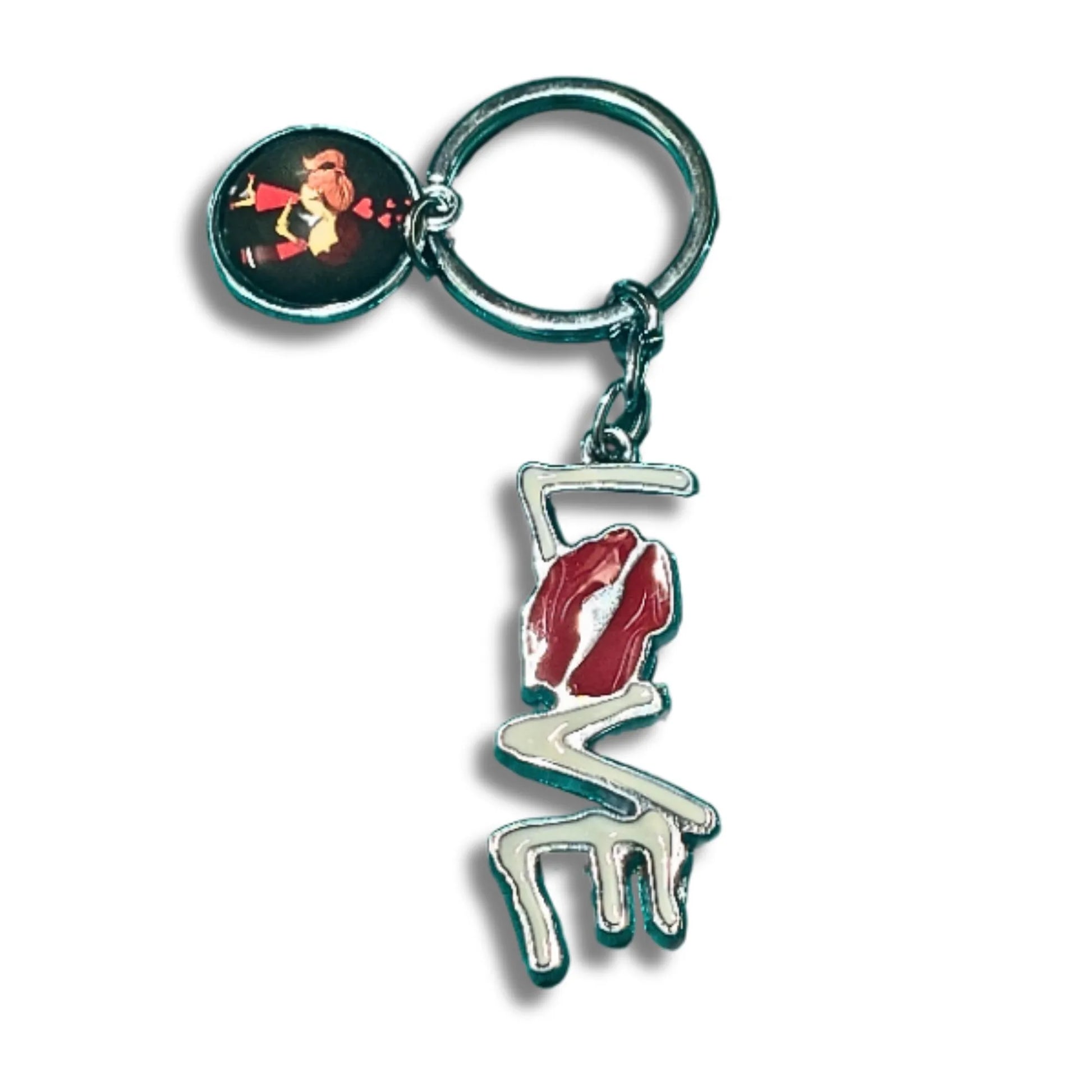 A metal keychain featuring a stylized white and red lips charm with a silver-tone outline, attached to a round key ring and a small oval charm showing a kiss graphic, set against a plain white background.