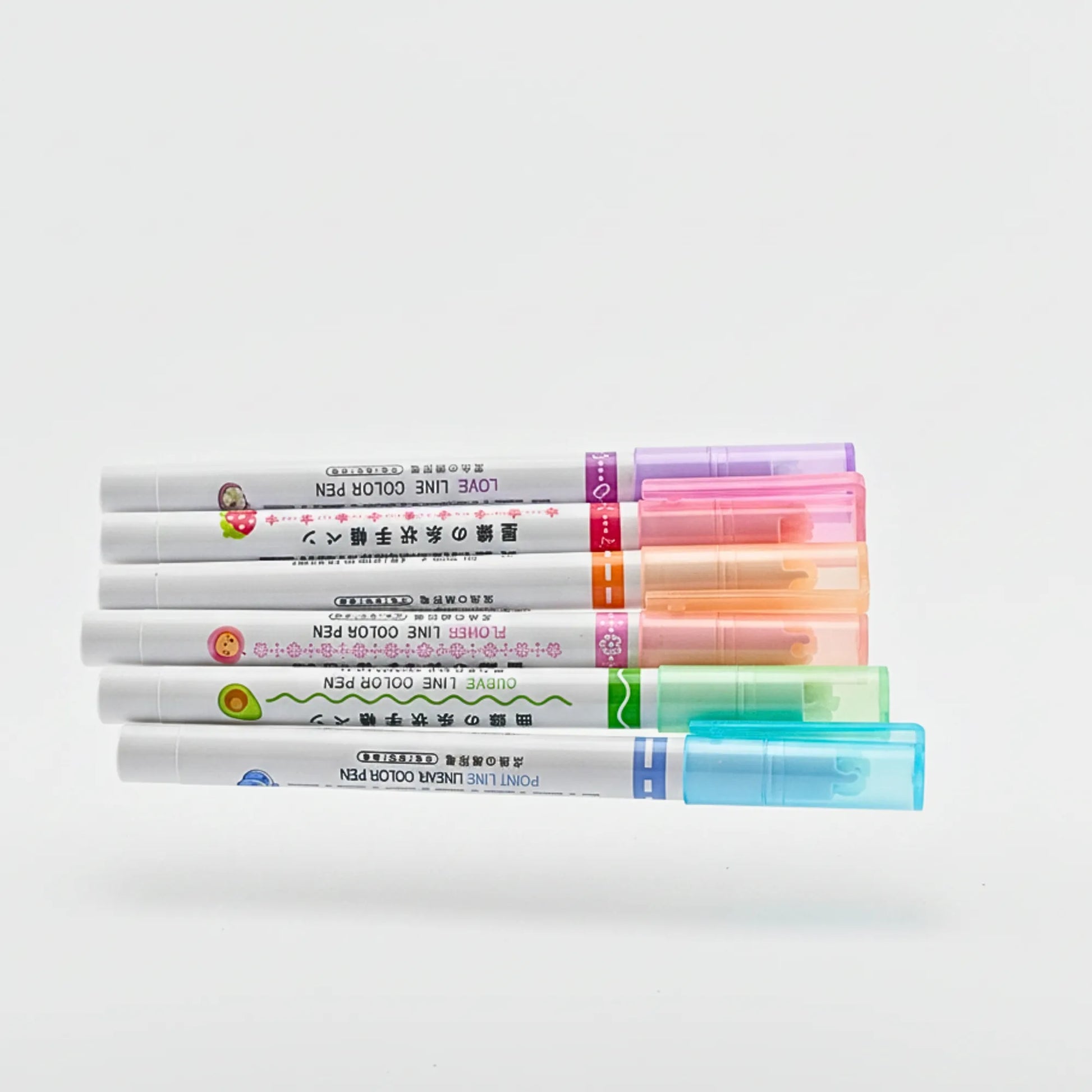 Set of colorful markers on a white background