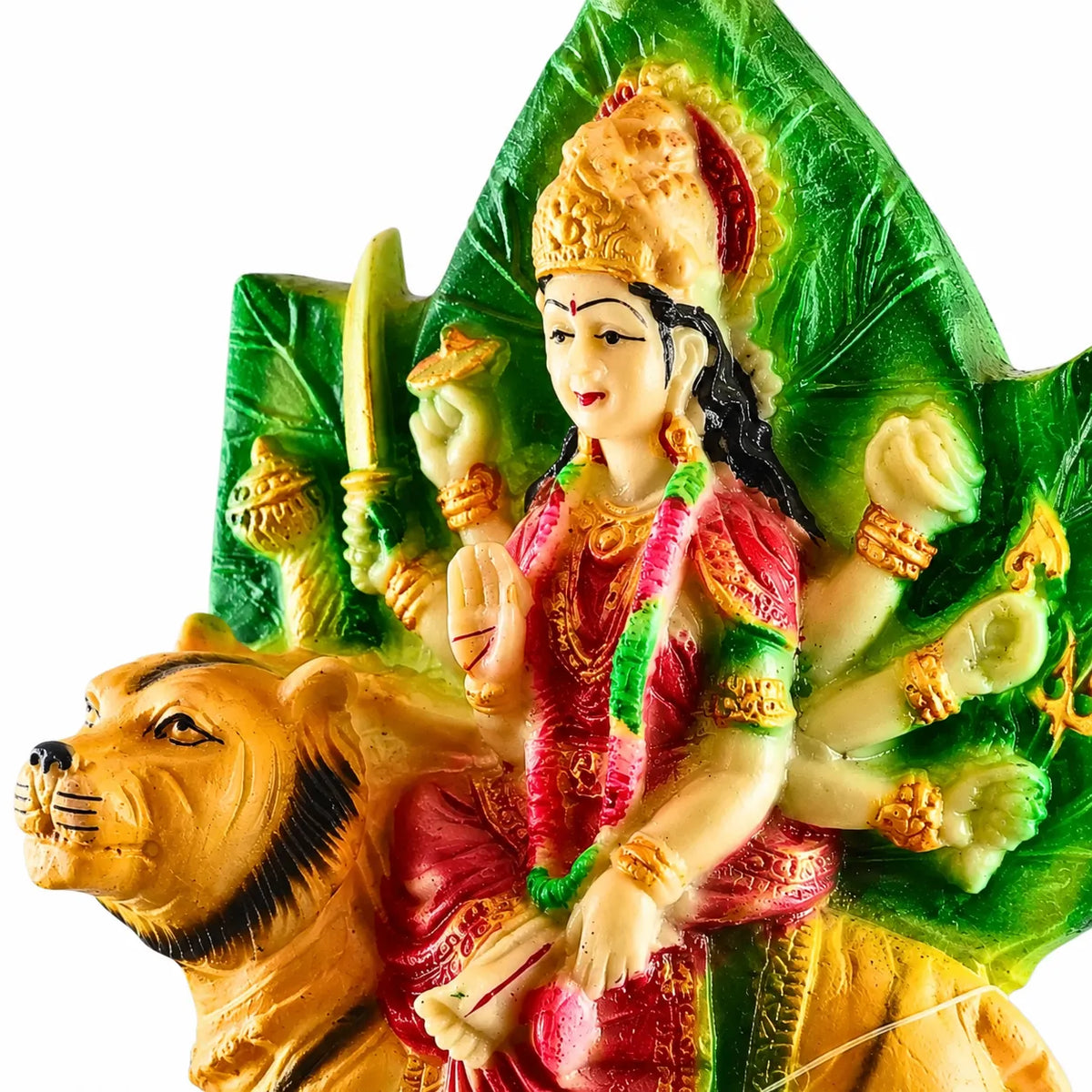 A colorful resin statue of the Hindu goddess Durga riding a lion, set against a solid white background.
