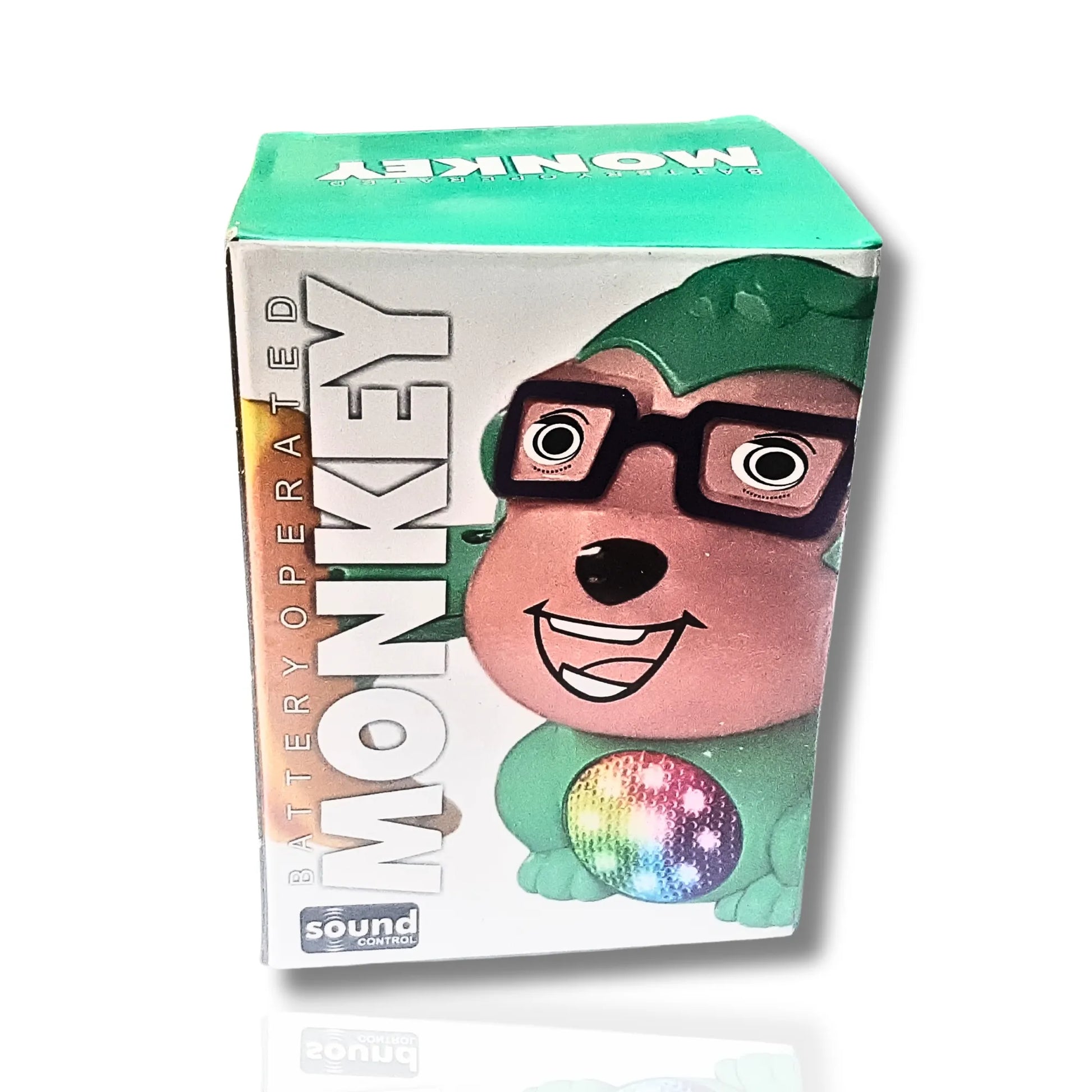 Box of a battery-operated monkey toy with a colorful disc on a white background