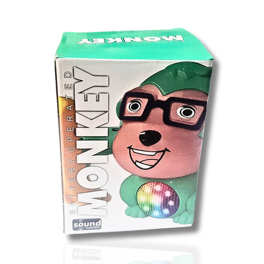 Box of a battery-operated monkey toy with a colorful disc on a white background