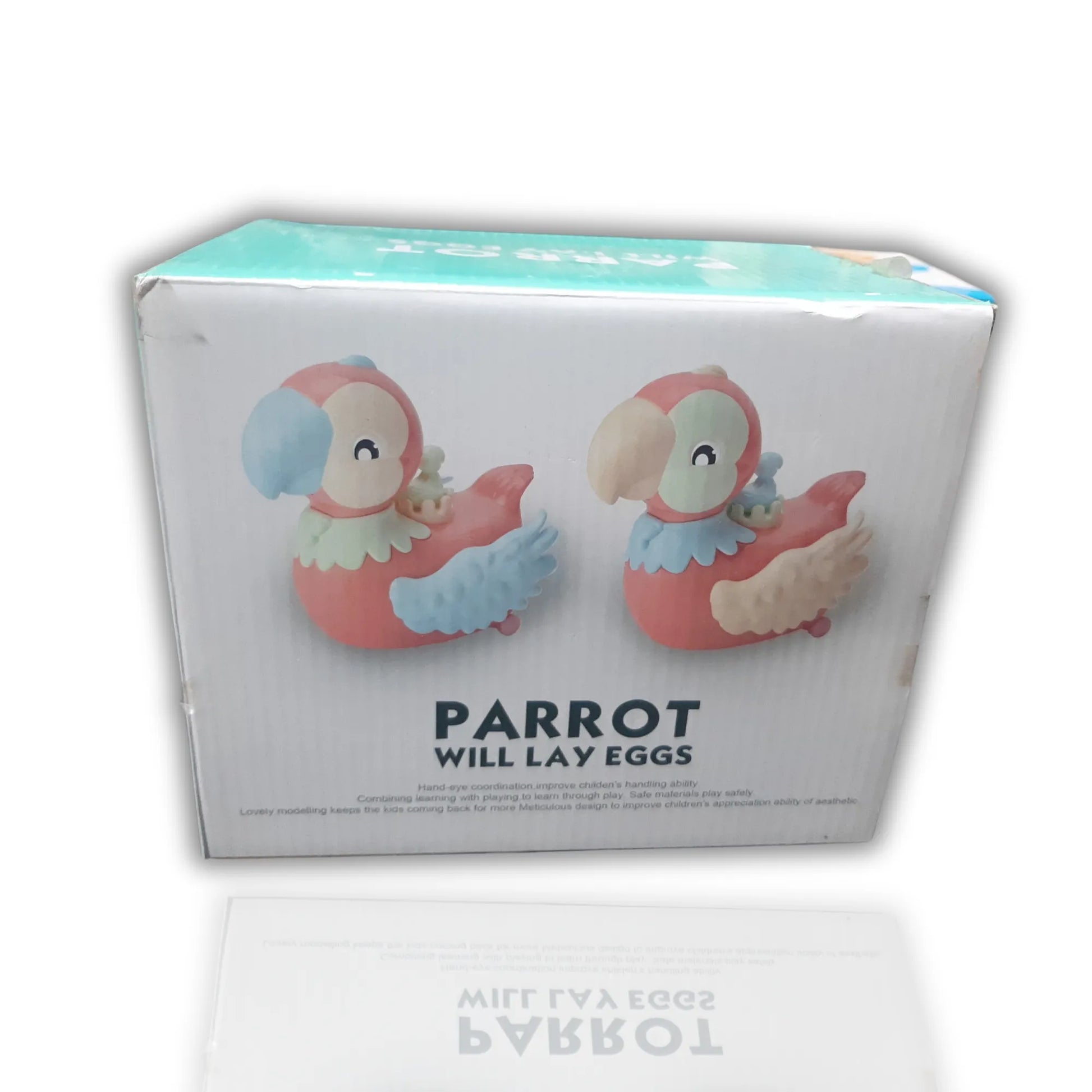 Box of parrot figurines with text 'Parrot will lay eggs' on a white background