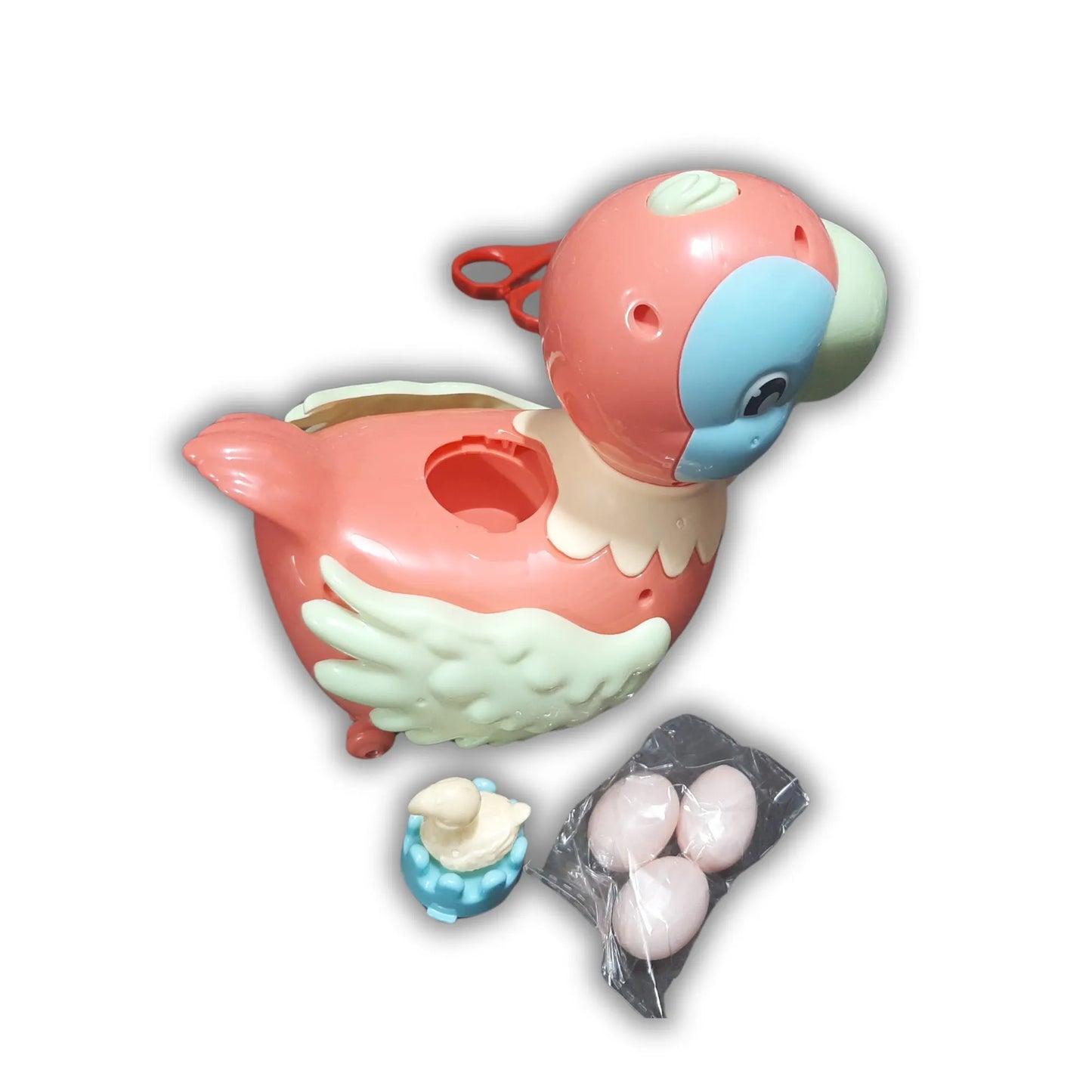 Colorful duck-shaped toy with small toys on a white background