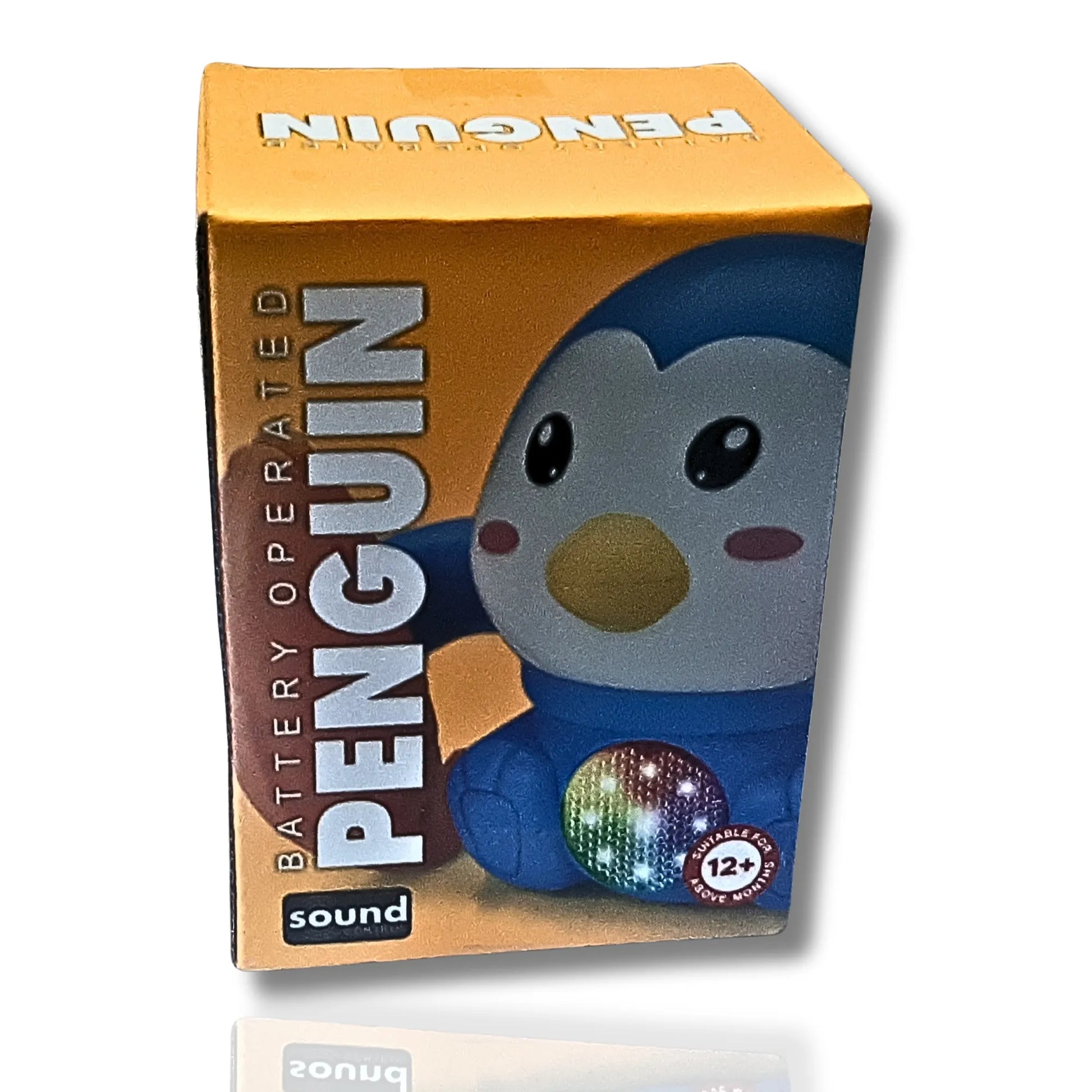Box of a battery-operated penguin toy with colorful disco ball on a white background