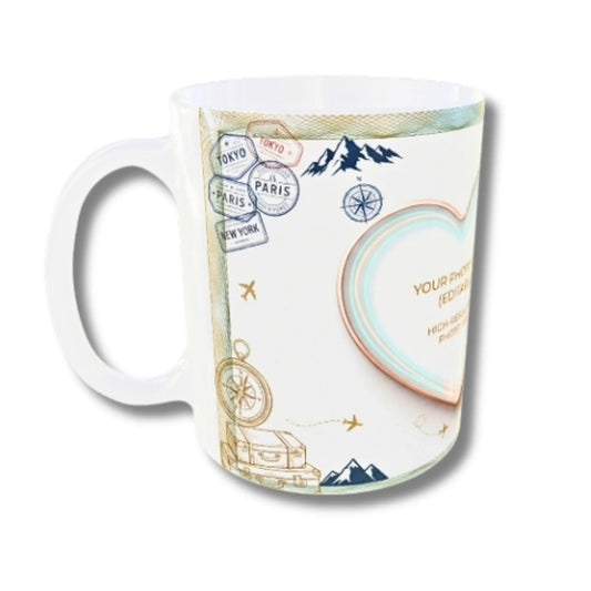 A white ceramic mug featuring a travel-themed print with post stamps, compasses, mountains, and a heart-shaped photo frame placeholder.