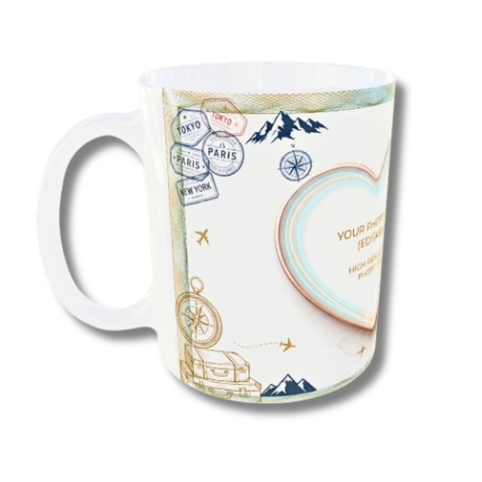 A white ceramic mug featuring a travel-themed print with post stamps, compasses, mountains, and a heart-shaped photo frame placeholder.