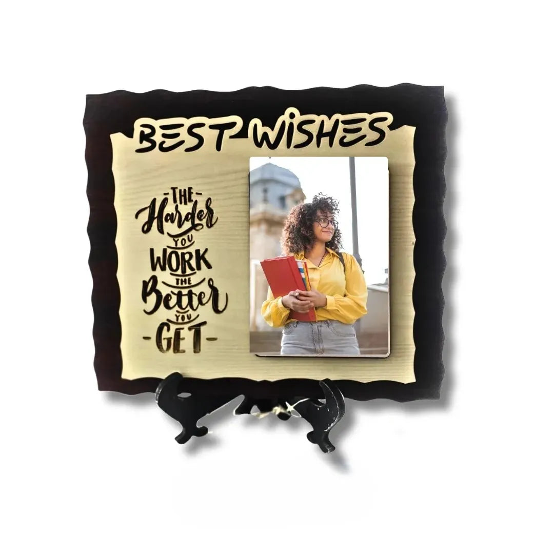 Decorative photo frame with motivational quote and person holding a book