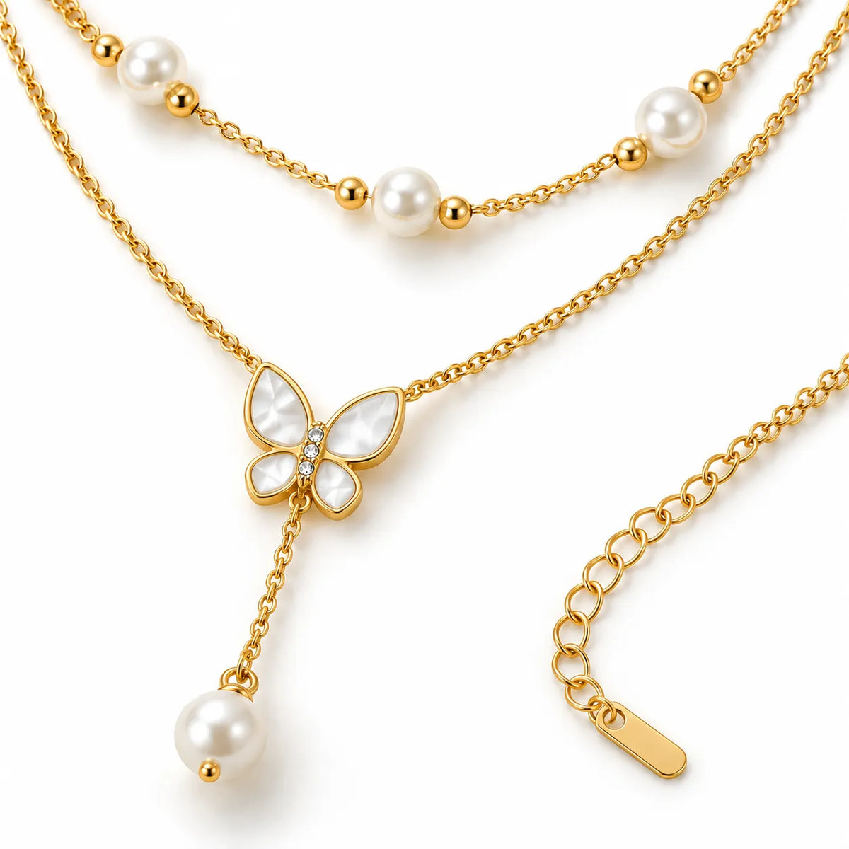 A gold-tone layered necklace featuring a central butterfly pendant with mother-of-pearl wings, a dangling pearl bead, and pearl accents spaced along the chain, shown on a clean white background.