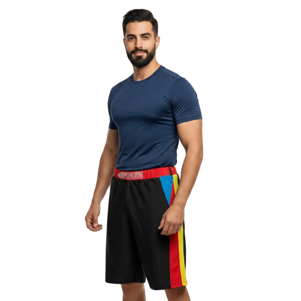Man wearing a navy blue athletic shirt and black shorts with colorful stripes on a white background