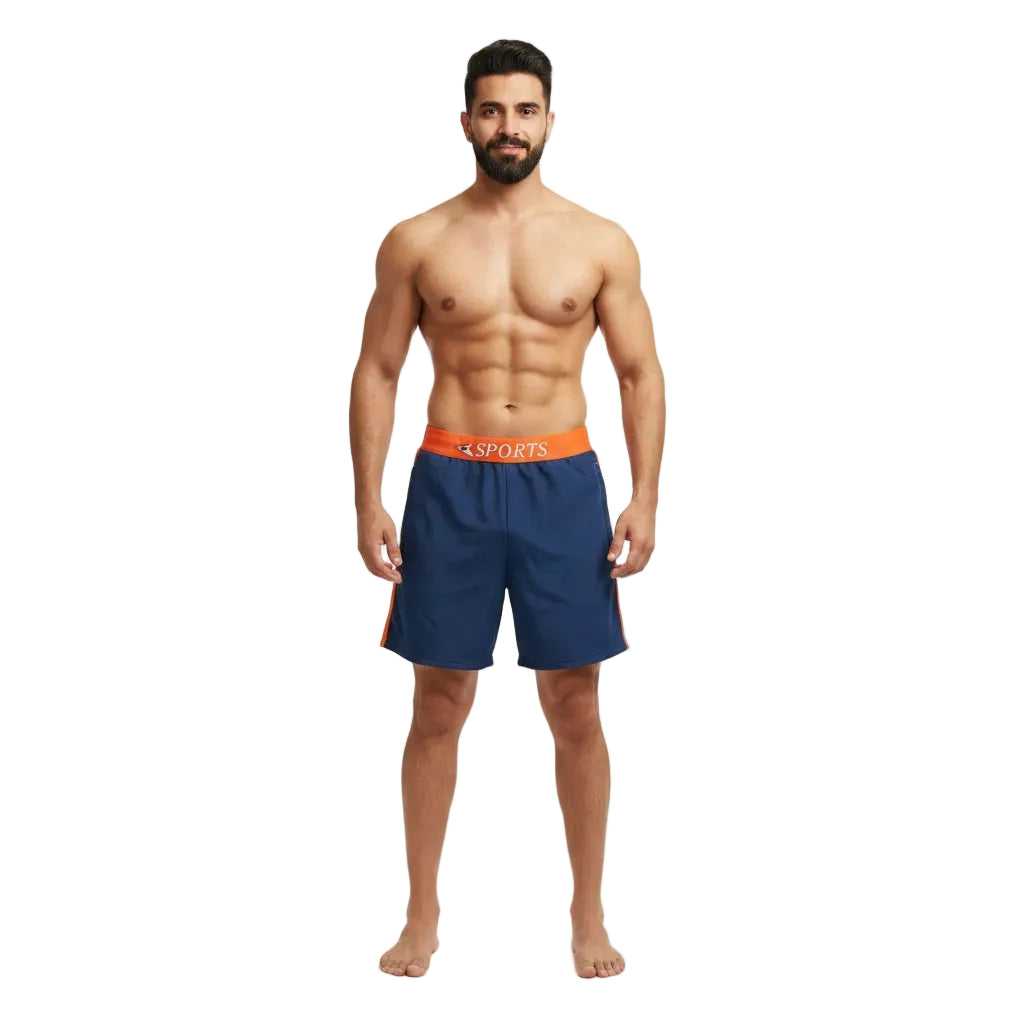 Man wearing navy blue athletic shorts with orange waistband on a white background