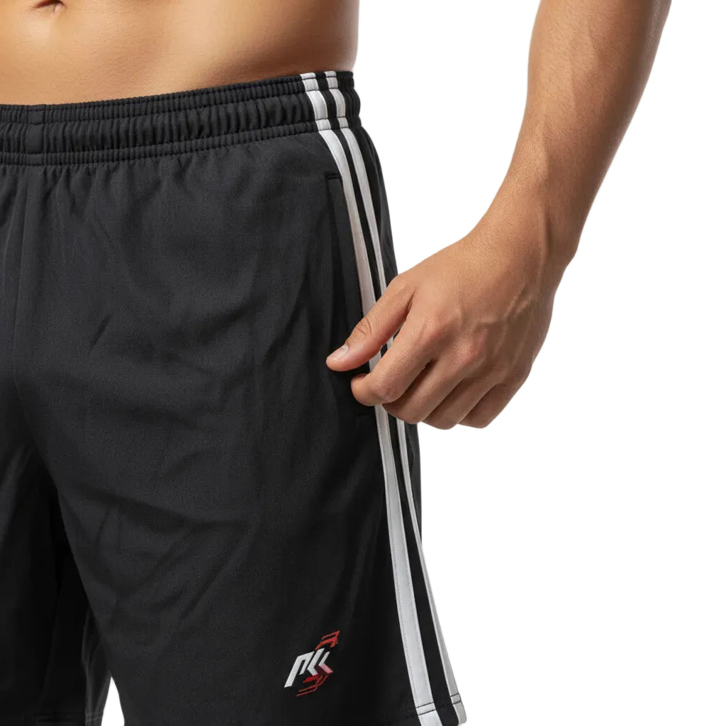 Black athletic shorts with white stripes on a neutral background