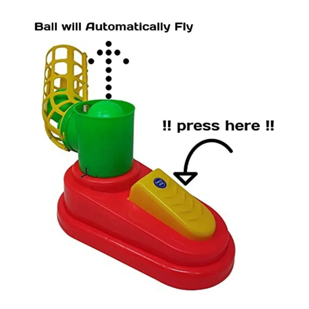 Toy device with a red base, green middle section, and yellow top, featuring text indicating it will automatically fly a ball when pressed.