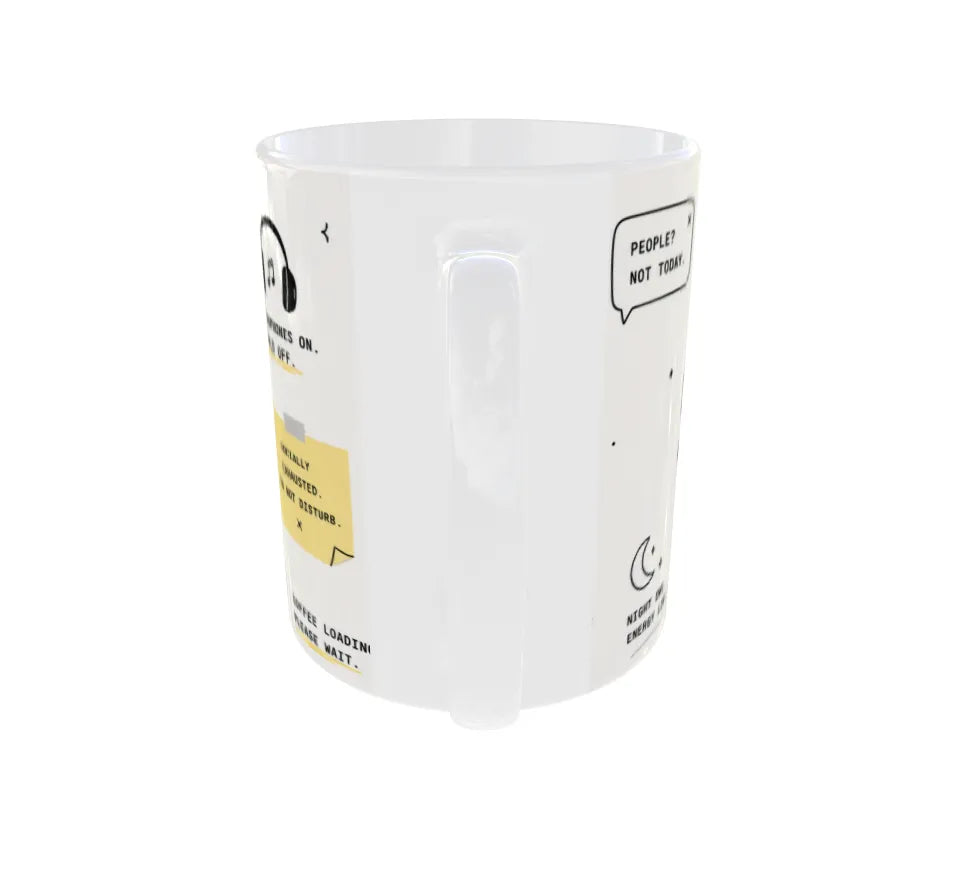 Angled view displaying humorous introvert-themed illustrations around the mug.