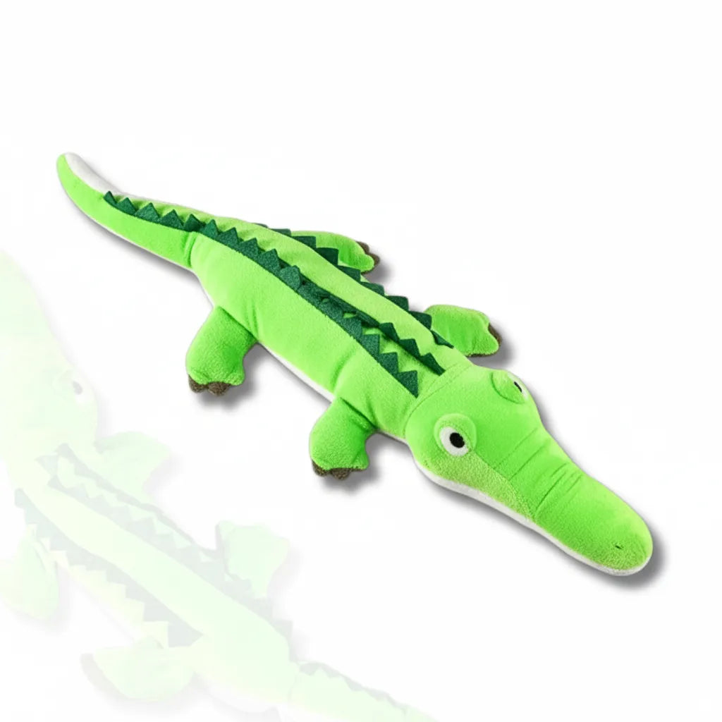 Green plush alligator toy on a white background