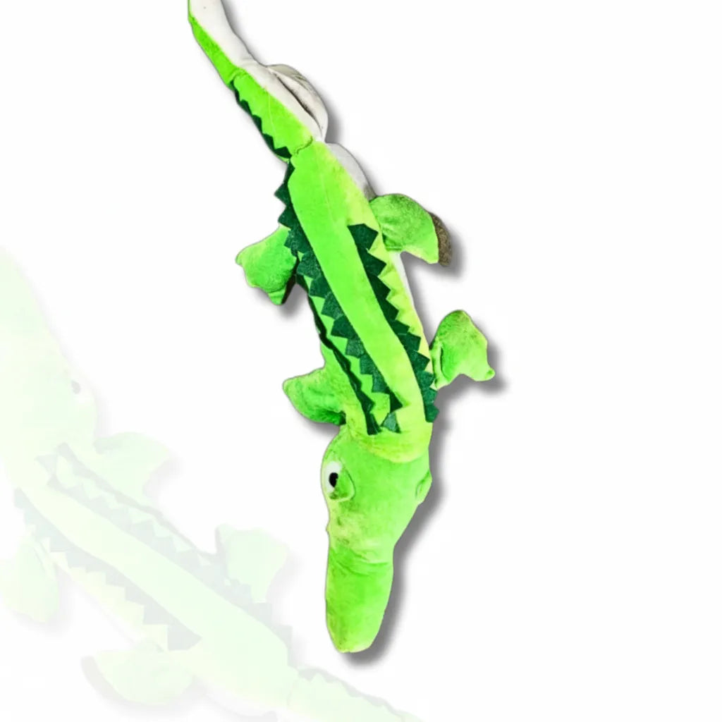 Green alligator plush toy on a white background