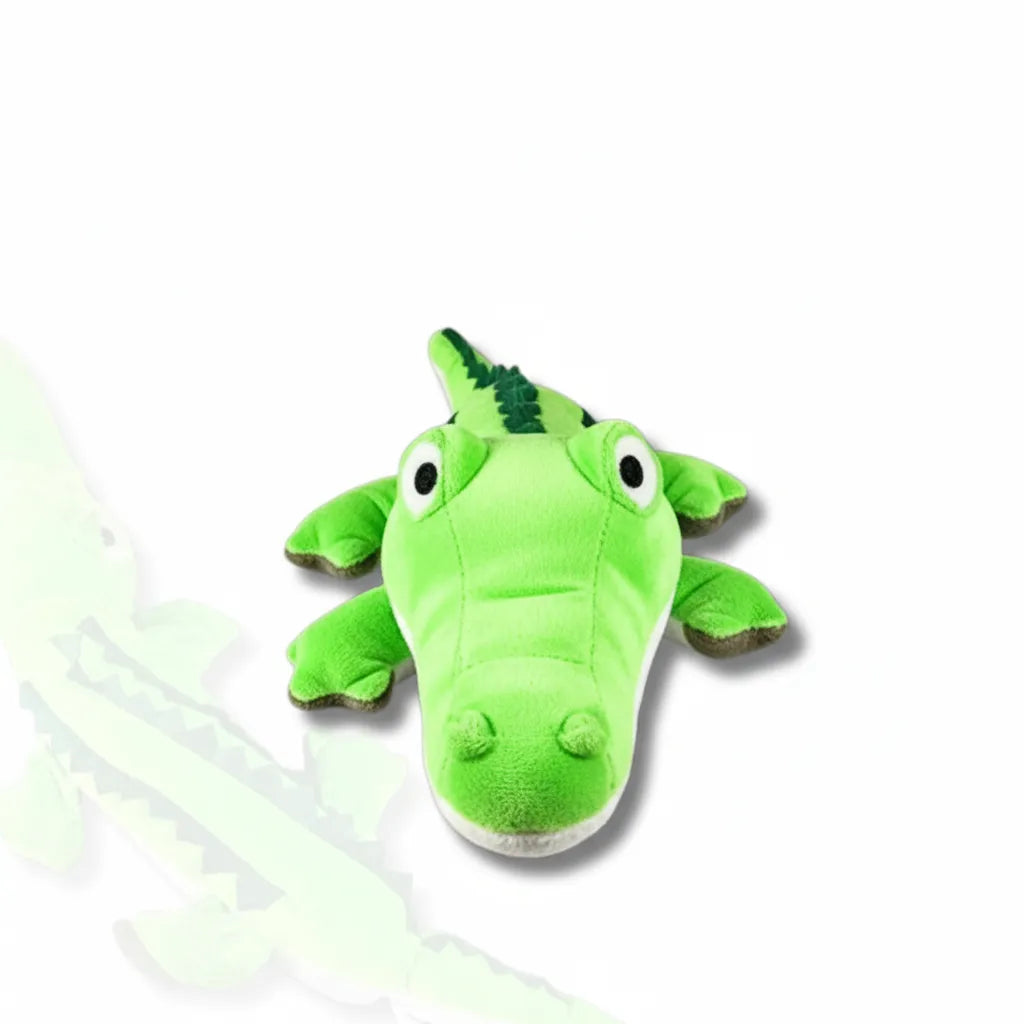 Green plush alligator toy on a white background