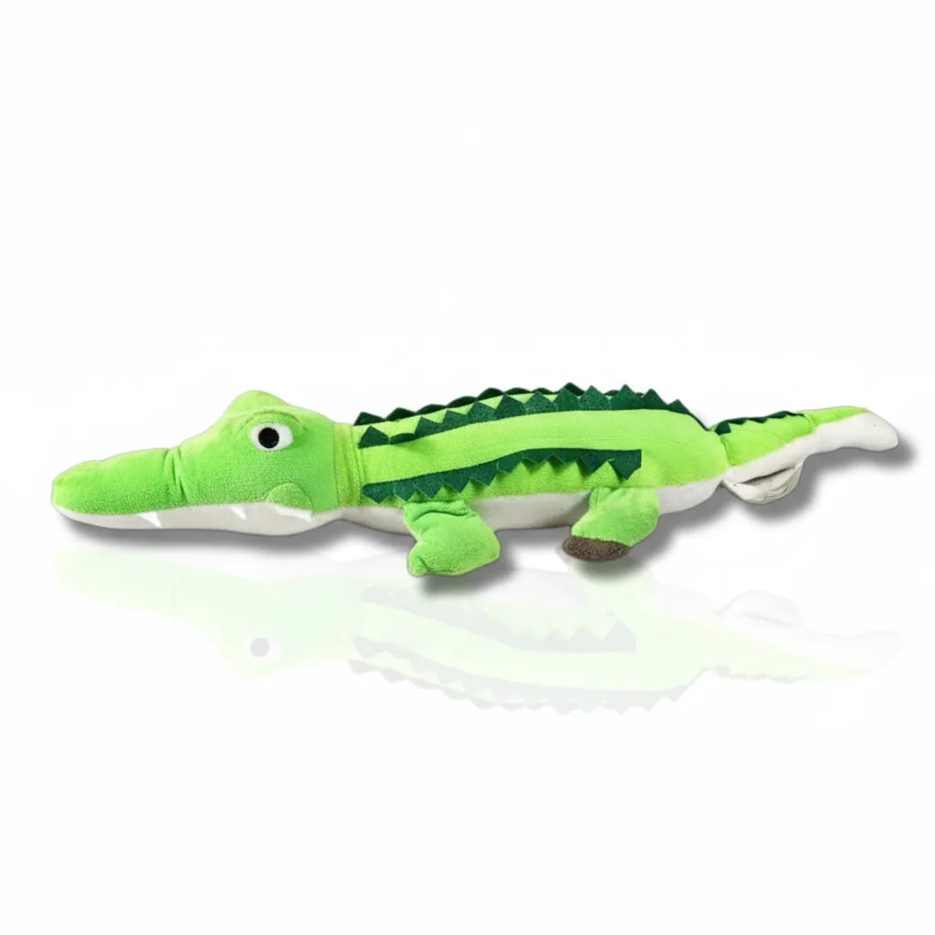Green alligator plush toy on a white background