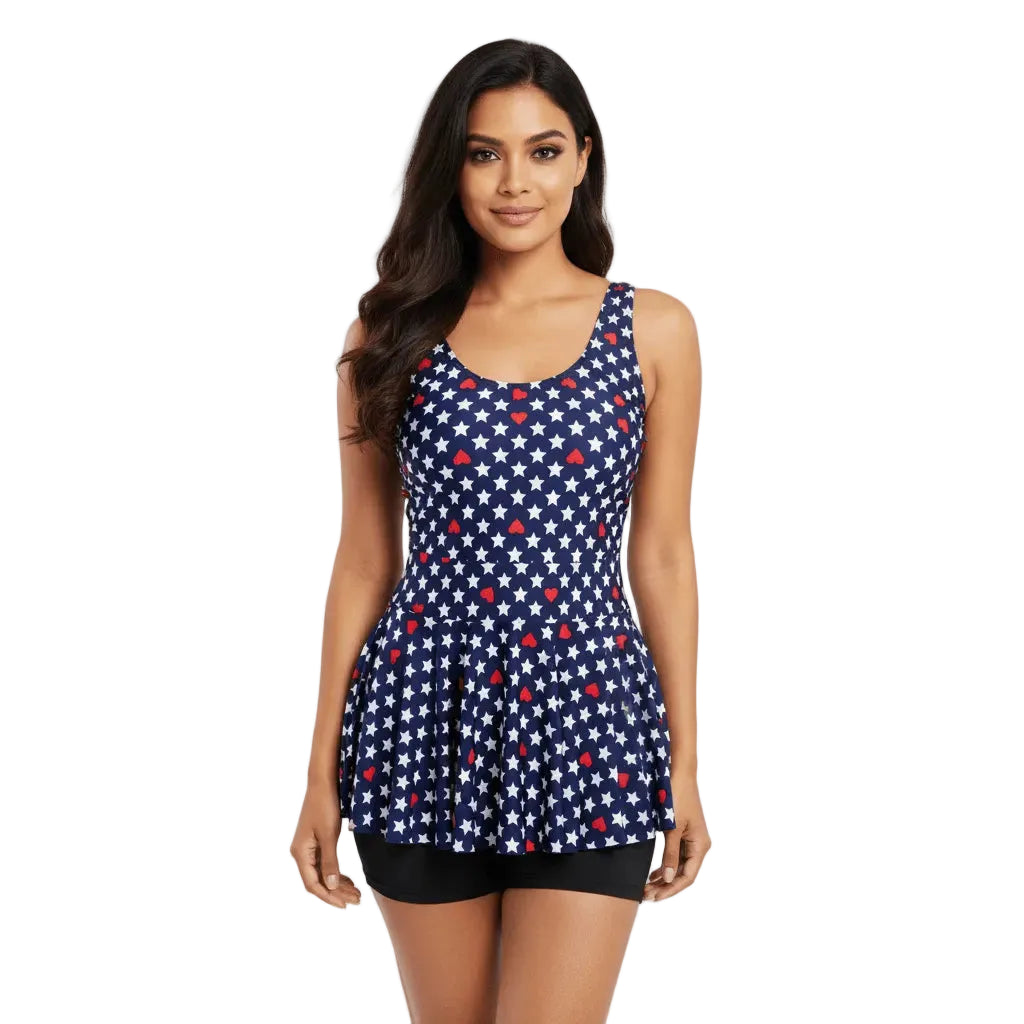 Woman wearing a navy blue tank top with red and white star pattern on a white background